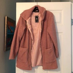 A light pink statement jacket